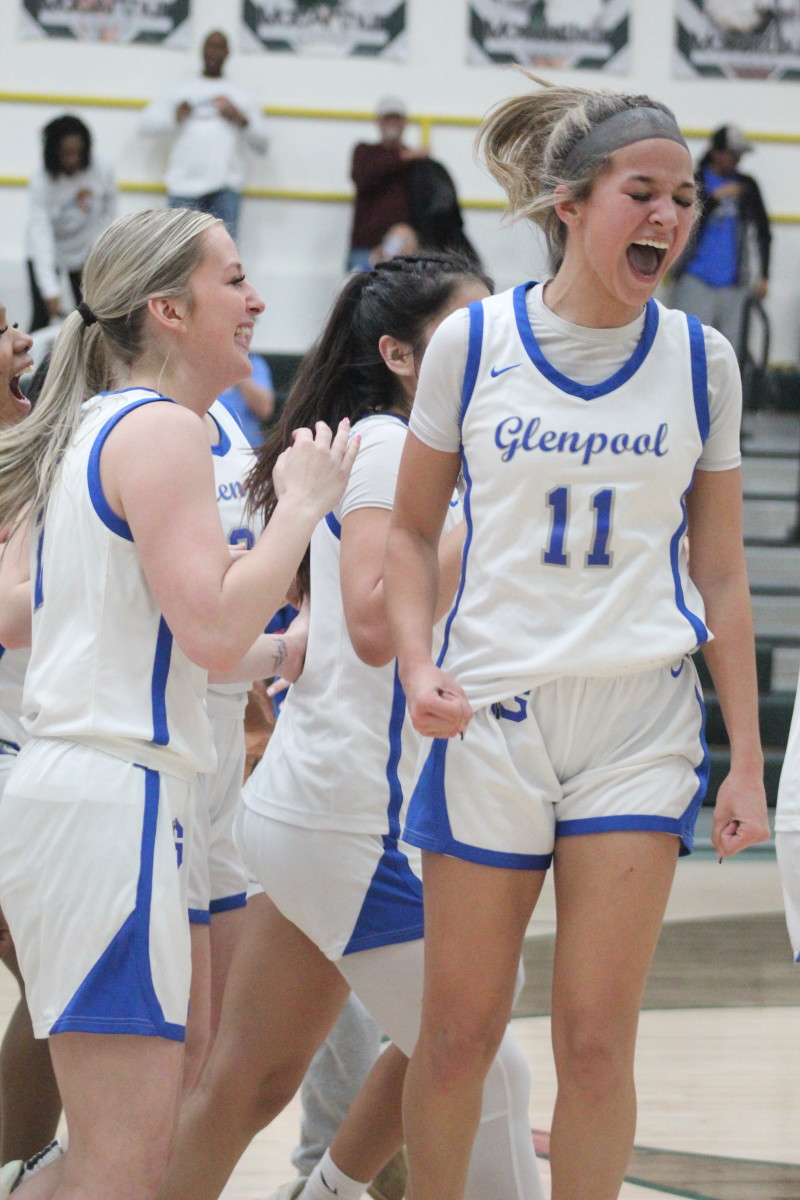 Glenpool players celebrate their Class 5A regional tournament win. 